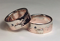 Custom two tone mountain range band with bear and sapphire