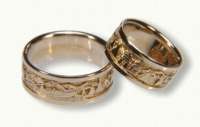 14kt yellow gold with rails<br>Mountian stream rafting on his<br>Mountians and trees on hers